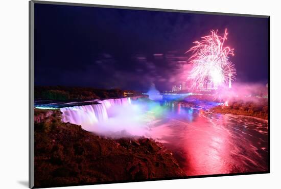 Niagara Falls Lit at Night by Colorful Lights with Fireworks-Songquan Deng-Mounted Photographic Print