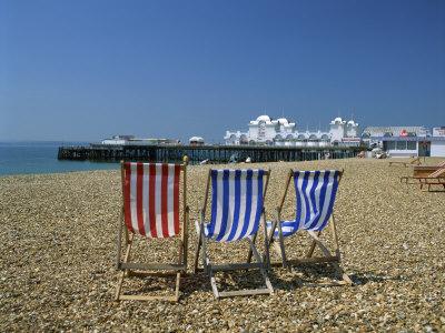 Empty Deck Chairs on the Beach and the Southsea Pier, Southsea, Hampshire, England, United Kingdom