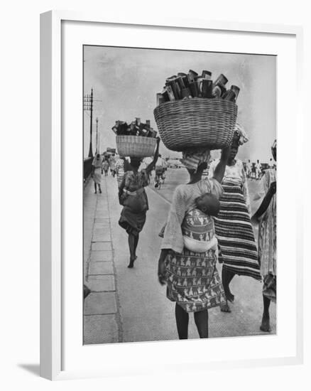 Nigerian Women with Babies Strapped to Their Backs Carrying Large Baskets on Their Heads-Alfred Eisenstaedt-Framed Photographic Print