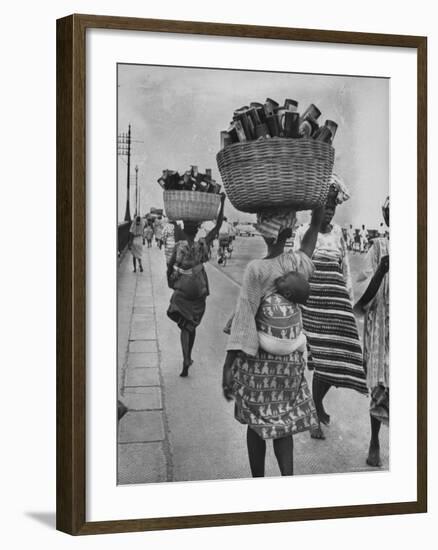 Nigerian Women with Babies Strapped to Their Backs Carrying Large Baskets on Their Heads-Alfred Eisenstaedt-Framed Photographic Print
