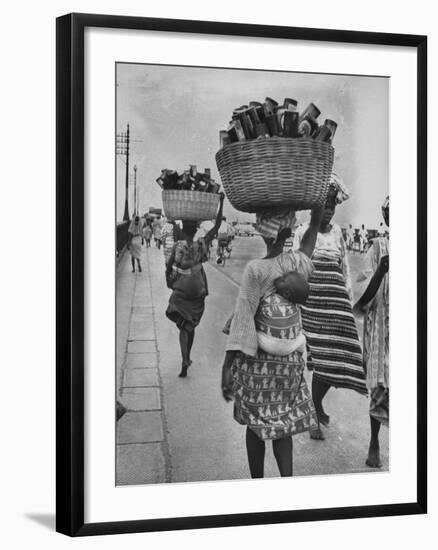 Nigerian Women with Babies Strapped to Their Backs Carrying Large Baskets on Their Heads-Alfred Eisenstaedt-Framed Photographic Print