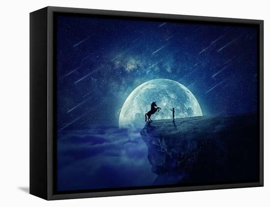 Night Scene with Boy Standing at Edge of Cliff Chasm Trying to Tame Wild Unicorn-Bordeianu Andrei-Framed Stretched Canvas