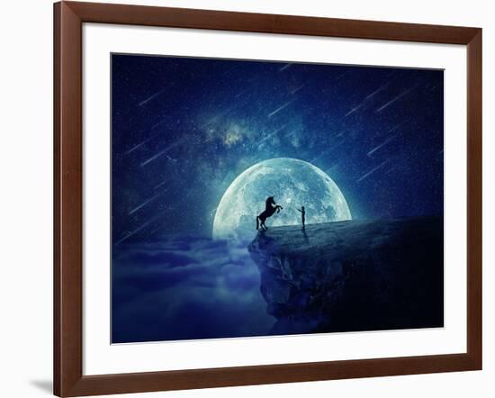 Night Scene with Boy Standing at Edge of Cliff Chasm Trying to Tame Wild Unicorn-Bordeianu Andrei-Framed Photographic Print