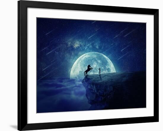 Night Scene with Boy Standing at Edge of Cliff Chasm Trying to Tame Wild Unicorn-Bordeianu Andrei-Framed Photographic Print