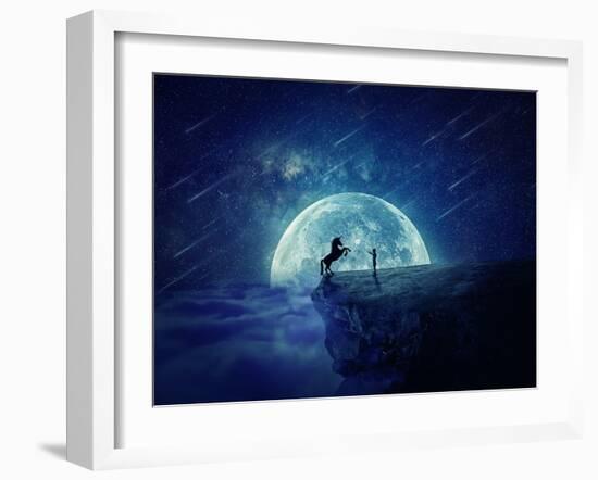 Night Scene with Boy Standing at Edge of Cliff Chasm Trying to Tame Wild Unicorn-Bordeianu Andrei-Framed Photographic Print