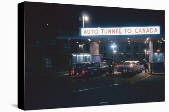 Nighttime View of the Cars at the Entrance to the Detroit-Windsor Tunnel, Detroit, Michigan, 1959-Fritz Goro-Stretched Canvas