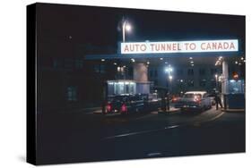 Nighttime View of the Cars at the Entrance to the Detroit-Windsor Tunnel, Detroit, Michigan, 1959-Fritz Goro-Stretched Canvas