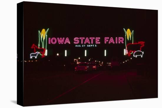 Nighttime View of the Illuminate Neon Sign at the Entrance to the Iowa State Fair, 1955-John Dominis-Stretched Canvas