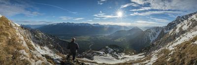 Panorama Seen from Sunset Through a Cairn on Pirchkogel with Snow, Summit Cross and Prayer Flags-Niki Haselwanter-Photographic Print