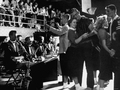 Teenage Couples Without Shoes Dancing at Carlsbad High School Sock Hop