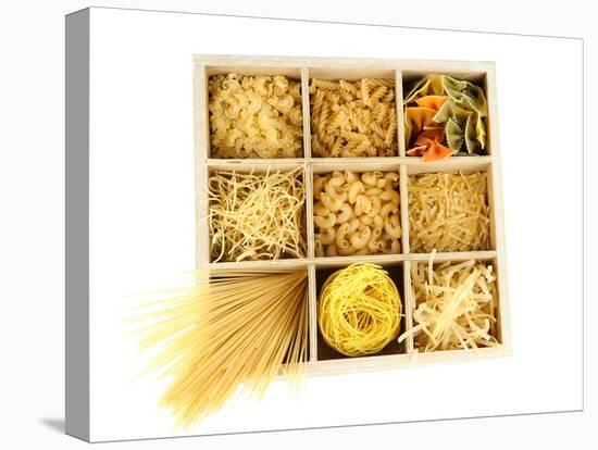 Nine Types Of Pasta In Wooden Box Sections Isolated On White-Yastremska-Stretched Canvas