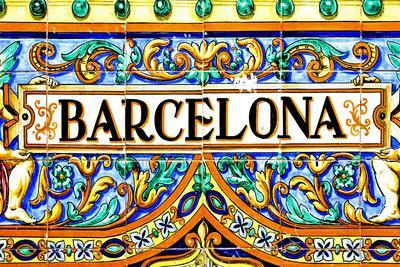 A Barcelona Sign Over A Mosaic Wall
