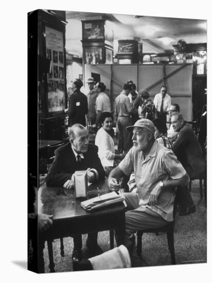 Noel Coward Chatting with Ernest Hemingway at Sloppy Joe's Bar-Peter Stackpole-Stretched Canvas