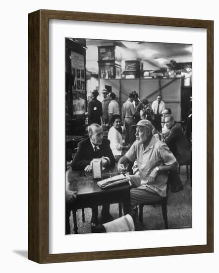 Noel Coward Chatting with Ernest Hemingway at Sloppy Joe's Bar-Peter Stackpole-Framed Premium Photographic Print