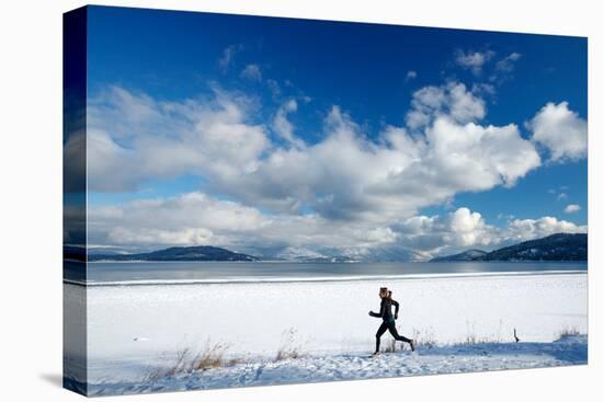 Noelle Zmuda Goes For Winter Run On The Pond Oreille Bay Trail, Sandpoint, Idaho. Lake Pend Oreille-Ben Herndon-Stretched Canvas