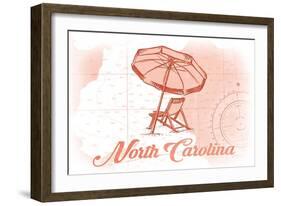 North Carolina - Beach Chair and Umbrella - Coral - Coastal Icon-Lantern Press-Framed Art Print