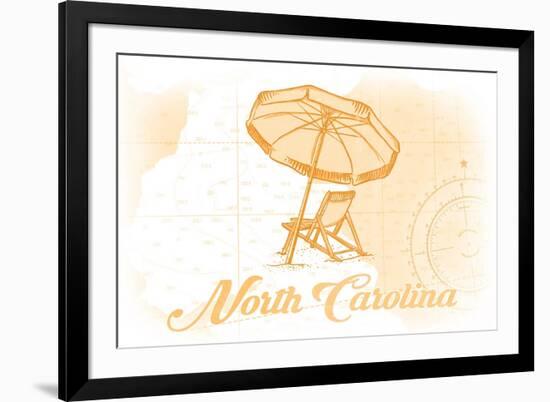 North Carolina - Beach Chair and Umbrella - Yellow - Coastal Icon-Lantern Press-Framed Premium Giclee Print