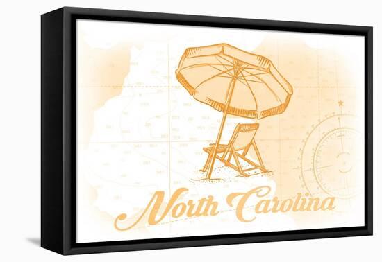 North Carolina - Beach Chair and Umbrella - Yellow - Coastal Icon-Lantern Press-Framed Stretched Canvas