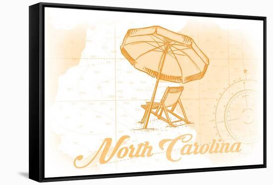 North Carolina - Beach Chair and Umbrella - Yellow - Coastal Icon-Lantern Press-Framed Stretched Canvas