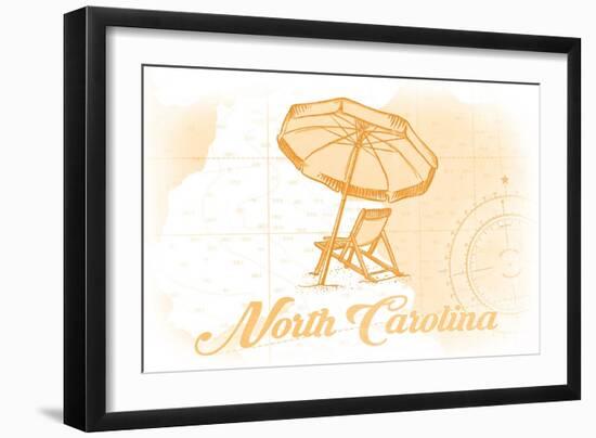 North Carolina - Beach Chair and Umbrella - Yellow - Coastal Icon-Lantern Press-Framed Art Print