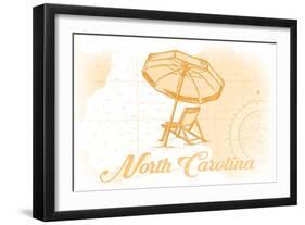 North Carolina - Beach Chair and Umbrella - Yellow - Coastal Icon-Lantern Press-Framed Art Print