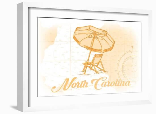 North Carolina - Beach Chair and Umbrella - Yellow - Coastal Icon-Lantern Press-Framed Art Print