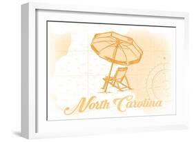 North Carolina - Beach Chair and Umbrella - Yellow - Coastal Icon-Lantern Press-Framed Art Print