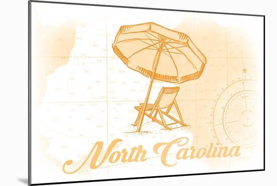 North Carolina - Beach Chair and Umbrella - Yellow - Coastal Icon-Lantern Press-Mounted Art Print