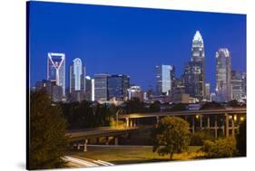 North Carolina, Charlotte, Elevated View of the City Skyline at Dawn-Walter Bibikow-Stretched Canvas