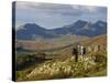 North Wales, Snowdonia; a Man and Woman Stop to Look at their Map Whilst Hiking in Snowdonia;-John Warburton-lee-Stretched Canvas
