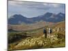 North Wales, Snowdonia; a Man and Woman Stop to Look at their Map Whilst Hiking in Snowdonia;-John Warburton-lee-Mounted Photographic Print