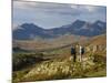 North Wales, Snowdonia; a Man and Woman Stop to Look at their Map Whilst Hiking in Snowdonia;-John Warburton-lee-Mounted Photographic Print