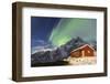 Northern Lights (Aurora Borealis) Illuminate Snowy Peaks and Wooden Cabin on a Starry Night-Roberto Moiola-Framed Photographic Print