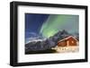 Northern Lights (Aurora Borealis) Illuminate Snowy Peaks and Wooden Cabin on a Starry Night-Roberto Moiola-Framed Photographic Print