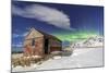 Northern Lights (Aurora Borealis) over an Abandoned Log Cabin Surrounded by Snow and Ice-Roberto Moiola-Mounted Photographic Print