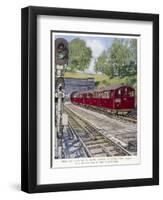 Northern Line Train on It's Way to Kennington Via Charing Cross Emerges Overground from a Tunnel-Raymond Way-Framed Art Print