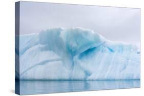 Norway. Svalbard. Brasvelbreen. Turquoise Ice Bergs in the Calm Water-Inger Hogstrom-Stretched Canvas