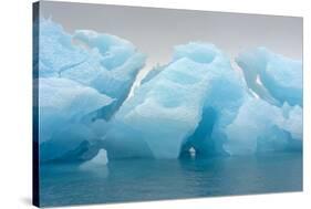 Norway. Svalbard. Brasvelbreen. Turquoise Ice Bergs in the Calm Water-Inger Hogstrom-Stretched Canvas