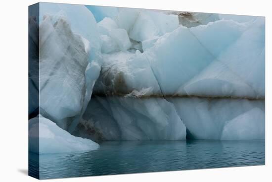 Norway. Svalbard. Brasvelbreen. Turquoise Ice Bergs in the Calm Water-Inger Hogstrom-Stretched Canvas