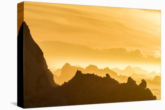 Norway, Svalbard, Nordaustlandet. Silhouette of Icebergs Backlit at Sunset-Jaynes Gallery-Stretched Canvas