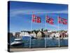 Norwegian Flags and Historic Harbour Warehouses, Stavanger, Norway, Scandinavia, Europe-Christian Kober-Stretched Canvas