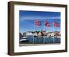 Norwegian Flags and Historic Harbour Warehouses, Stavanger, Norway, Scandinavia, Europe-Christian Kober-Framed Photographic Print