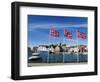 Norwegian Flags and Historic Harbour Warehouses, Stavanger, Norway, Scandinavia, Europe-Christian Kober-Framed Photographic Print