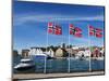 Norwegian Flags and Historic Harbour Warehouses, Stavanger, Norway, Scandinavia, Europe-Christian Kober-Mounted Photographic Print