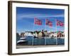 Norwegian Flags and Historic Harbour Warehouses, Stavanger, Norway, Scandinavia, Europe-Christian Kober-Framed Photographic Print