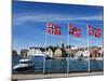 Norwegian Flags and Historic Harbour Warehouses, Stavanger, Norway, Scandinavia, Europe-Christian Kober-Mounted Photographic Print