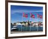 Norwegian Flags and Historic Harbour Warehouses, Stavanger, Norway, Scandinavia, Europe-Christian Kober-Framed Photographic Print