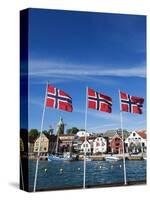 Norwegian Flags and Historic Harbour Warehouses, Stavanger, Norway, Scandinavia, Europe-Christian Kober-Stretched Canvas