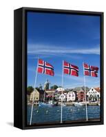 Norwegian Flags and Historic Harbour Warehouses, Stavanger, Norway, Scandinavia, Europe-Christian Kober-Framed Stretched Canvas