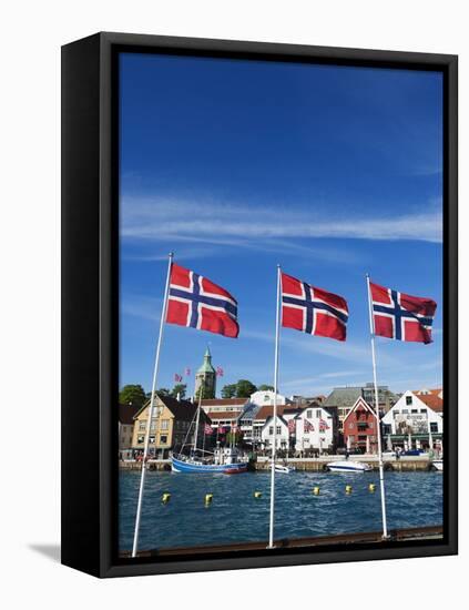 Norwegian Flags and Historic Harbour Warehouses, Stavanger, Norway, Scandinavia, Europe-Christian Kober-Framed Stretched Canvas